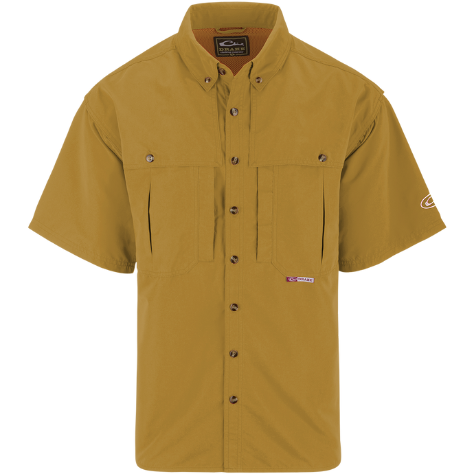 A yellow short sleeved shirt with front and back ventilation, oversized chest pockets, and a vertical zippered pocket. Perfect for outdoor activities.
