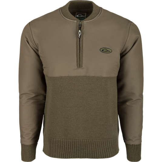 A 1/4 Zip Wool Sweater with a knitted 100% wool lower and a polyester upper treated with DWR for protection. Perfect for staying warm and comfortable in any weather.