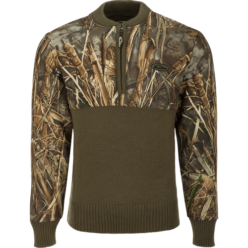 A camo 1/4 zip wool sweater with a polyester upper treated with DWR for protection against the elements. The 650-gram knitted 100% wool lower provides warmth and breathability.
