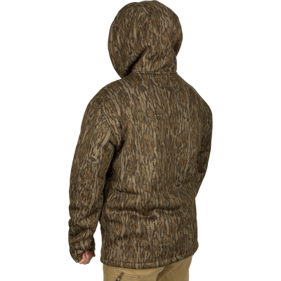 Person wearing the LST Silencer Fleece-Lined Hoodie with double-lined hood and kangaroo pouch, designed for warmth and mobility in hunting conditions.