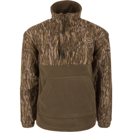 MST Youth Eqwader Quarter Zip Jacket with camo-patterned upper, olive fleece lower, features kangaroo pocket, branded zippers, designed for dual-zone comfort with waterproof and breathable materials.