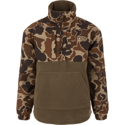 MST Youth Eqwader Quarter Zip Jacket with camo print sleeves, olive fleece body, kangaroo pocket, and dual-zone waterproof and breathable fabric for enhanced comfort in waterfowl hunting.