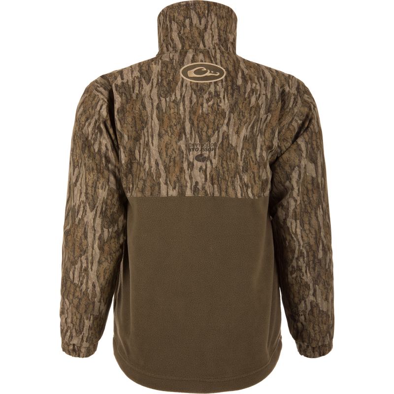 Back view of MST Youth Eqwader Full Zip Jacket, featuring Mossy Oak Bottomland camo on the upper half and olive-brown fleece below, designed for waterfowl hunting comfort.