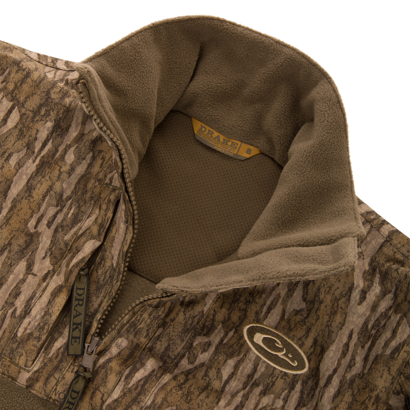 MST Youth Eqwader Full Zip Jacket with camo fleece, half-zip, stand-up collar, and interior mesh lining, featuring Drake branding on collar and zipper pulls.