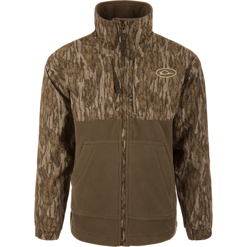 MST Youth Eqwader Full Zip Jacket featuring tree-bark camo print and olive-green fleece, stand-up collar, hand-warmer pockets, and dual-zone waterproof and breathable fabric.