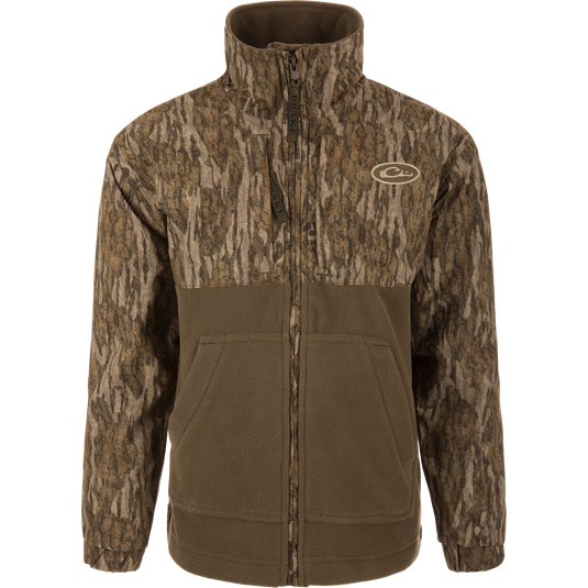 MST Youth Eqwader Full Zip Jacket featuring tree-bark camo print and olive-green fleece, stand-up collar, hand-warmer pockets, and dual-zone waterproof and breathable fabric.