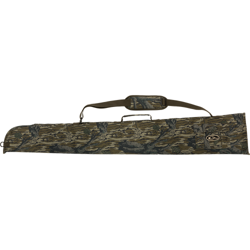 A side-opening gun case with a camouflage design, adjustable strap, and outer accessory pocket for choke tubes.