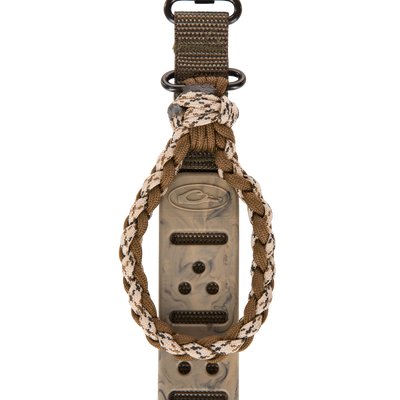 Gunslinger Waterfowl Shotgun Sling with Tree Loop featuring braided paracord, nylon strap, steel o-rings, and an integrated plastic call device for hunting convenience.