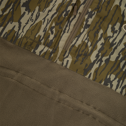 BFCM - MST Camo Eqwader 1/4 Zip Jacket featuring brown/olive camouflage nylon with a zip pocket and brown sherpa fleece, showcasing Drake's innovative waterfowl clothing technology.