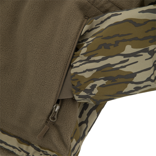 Close-up of BFCM - MST Camo Eqwader 1/4 Zip Jacket, showcasing tiger-stripe camo shell, brown fleece lining, and zippered pocket with pull tab.