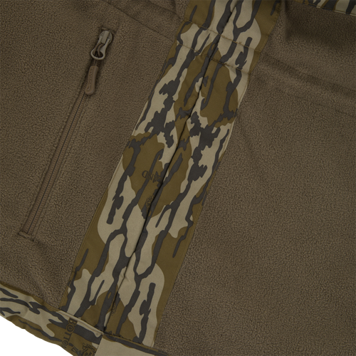 BFCM - MST Camo Eqwader 1/4 Zip Jacket in brown sherpa fleece with camouflage nylon accents, featuring a vertical zippered pocket and patented waterproof-breathable technology.