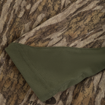 Drake Base Layer Crew Neck in a brown tree-bark camouflage pattern with a solid olive green cuff.