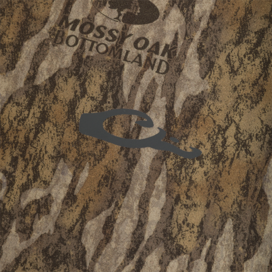Drake Base Layer Crew Neck in a brown, black, and tan tree bark camouflage pattern with a gray duck-shaped logo on the chest.