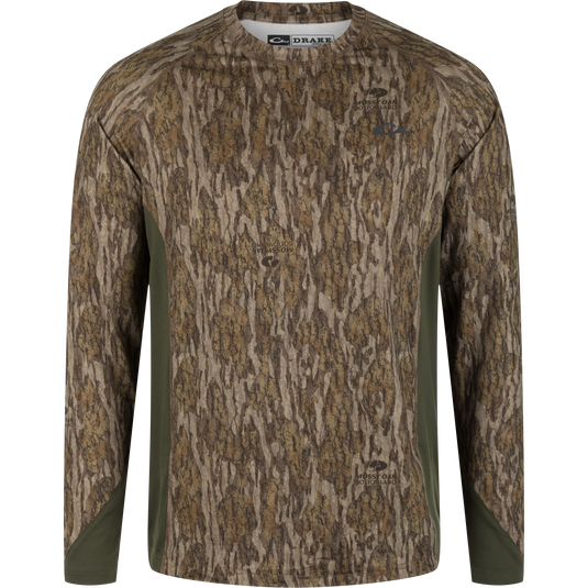 Drake Base Layer Crew Neck in Mossy Oak Bottomland featuring a brown and green camouflage pattern with solid olive green side panels.