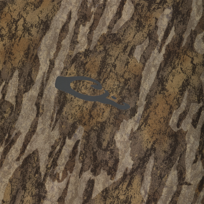 Close-up of a Drake Base Layer Bottom in a brown and tan tree bark camouflage pattern with a dark grey duck head logo in the center of the fabric.