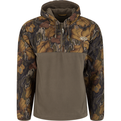 Waterproof, windproof MST Quarter Zip Refuge Eqwader Jacket with Hood featuring leaf-patterned camo shoulders and sleeves with a solid olive-green torso.