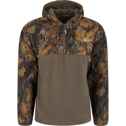 Waterproof, windproof MST Quarter Zip Refuge Eqwader Jacket with Hood featuring leaf-patterned camo shoulders and sleeves with a solid olive-green torso.