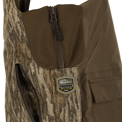 LST Guardian Elite Bibs: A close-up of a waterproof vest with a logo and zipper. Ideal for hunters in frigid weather conditions.