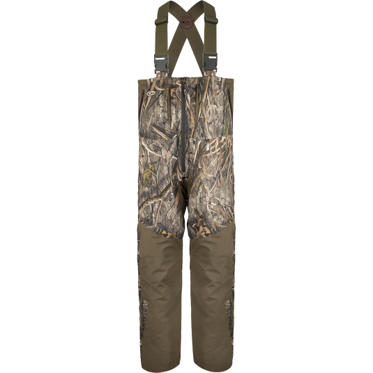 Guardian Flex™ G3 Flex™ Bib with BMZ System Liner: Camouflage overalls with adjustable suspenders and removable insulation panels for customizable warmth.
