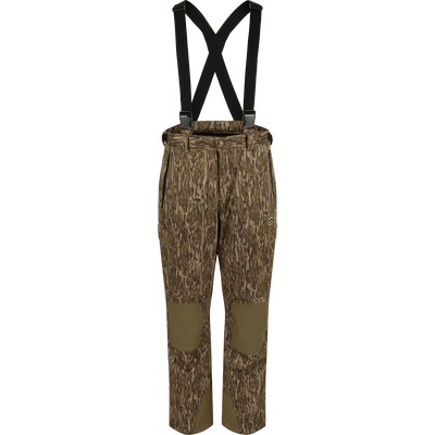 MST Waist-High Insulated Bibs with camouflage pattern and suspenders, featuring zippered pockets, adjustable Velcro waist, and heavy-duty elastic shoulder straps for secure fit.