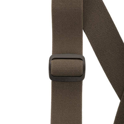 Close-up of the MST Waist-High Insulated Bibs' belt buckle, showcasing heavy-duty elastic suspenders and adjustable Velcro waist for a secure, customized fit.