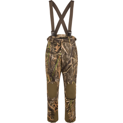 MST Waist-High Insulated Bibs with camouflage pattern, suspenders, and multiple zippered pockets for secure storage; designed for hunting with waterproof, insulated material.
