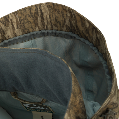 Close-up of the G3 Flex Uninsulated Waterfowlers Jacket, showcasing rugged, waterproof fabric, multiple pockets, adjustable features, and Drake's Fowl-Proof YKK zippers.