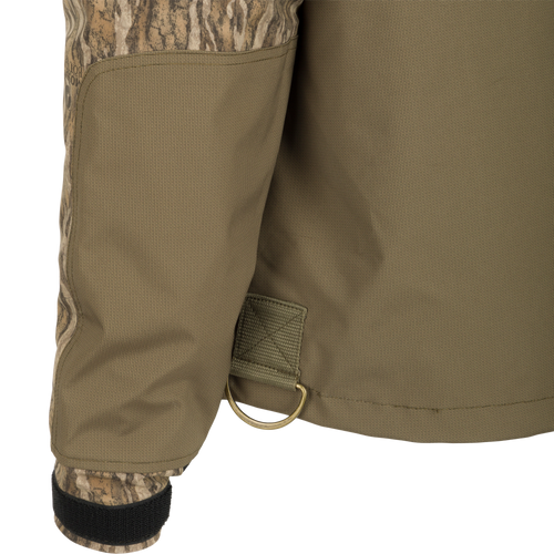 A close-up of the G3 Flex 3-in-1 Waterfowler's Jacket, showcasing its khaki fabric and functional design.