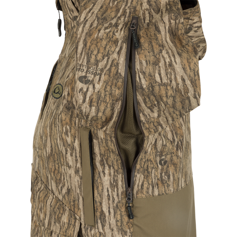 A versatile G3 Flex 3-in-1 Waterfowler's Jacket with a camouflage vest and zipper, perfect for hunting in various conditions.