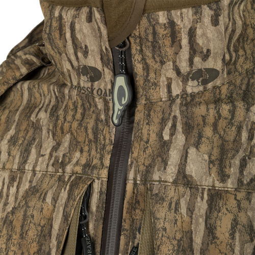 A close-up of the G3 Flex 3-in-1 Waterfowler's Jacket, showcasing its khaki fabric and functional features.