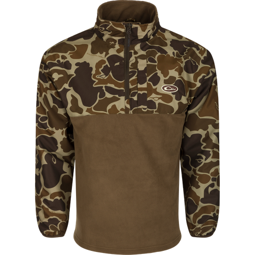 A camouflage MST 1/4 Zip Refuge Eqwader Pullover by Drake Waterfowl, featuring innovative waterproof/windproof/breathable fabric for hunters. Celebrating the Eqwader™ Hybrid System's legacy with advanced features for ultimate comfort and performance.