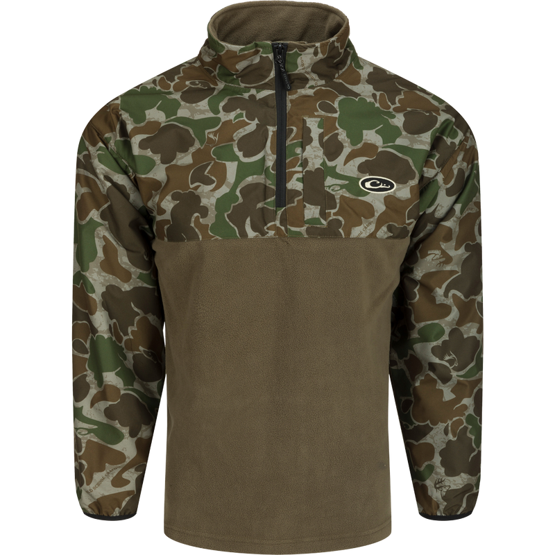 A camouflage MST 1/4 Zip Refuge Eqwader Pullover by Drake Waterfowl, featuring waterproof Refuge HS™ fabric with HyperShield™ 2.0 tech for comfort and performance in waterfowl hunting.