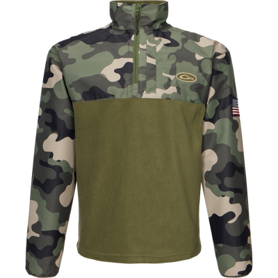 MST Quarter Zip Refuge Eqwader Jacket featuring a close-up of a camouflage pattern, a zipper, and a flag-adorned sleeve, designed for waterfowl hunting comfort and performance.