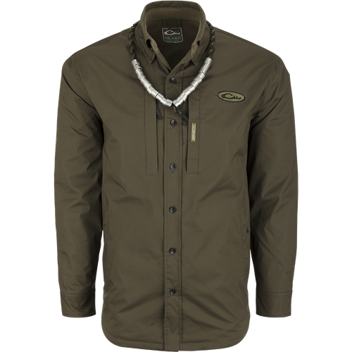A green shirt with a necklace, ideal for fluctuating weather conditions. Provides comfort like a shirt and waterproofing like a jacket. Plenty of pocket storage for essentials. MST Fleece-Lined Guardian Flex Jac-Shirt.