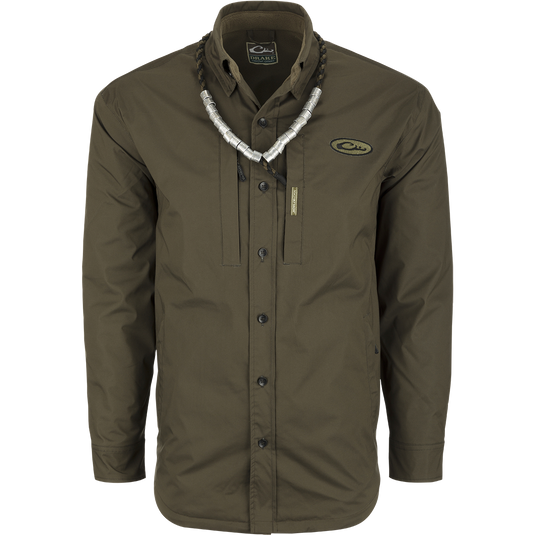 A green shirt with a necklace, ideal for fluctuating weather conditions. Provides comfort like a shirt and waterproofing like a jacket. Plenty of pocket storage for essentials. MST Fleece-Lined Guardian Flex Jac-Shirt.