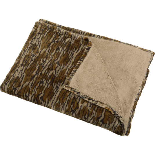 Camo Fleece Blanket featuring a brown-and-gray pattern on one side and tan sherpa fleece on the reverse, offering lightweight warmth.