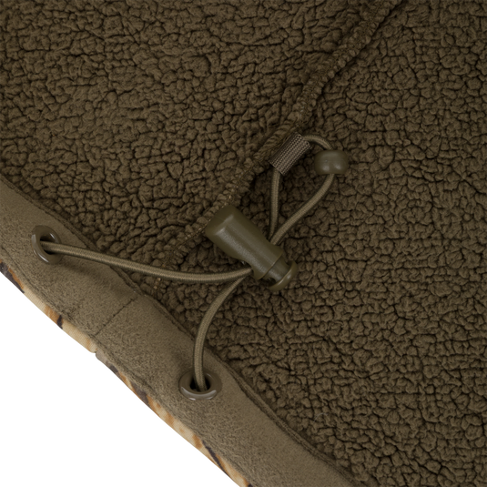 Close-up of an olive green polyester Slacker Wader Pocket Hoodie featuring an adjustable drawstring with a plastic cord lock.