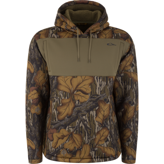 Slacker Wader Pocket Hoodie in Mossy Oak Fall Foliage camo-print polyester fleece with a solid olive green wader pocket panel across the upper chest.