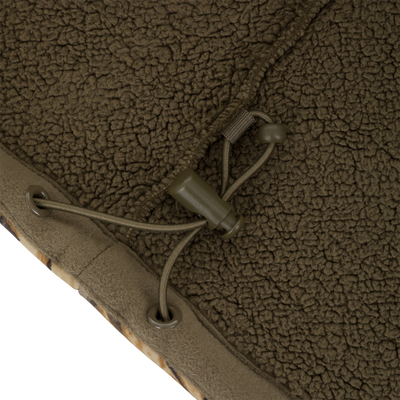 Close-up of an olive green Drake Waterfowl Slacker Quarter Zip Hoodie with High Handwarmer Pockets, featuring an adjustable drawstring and cord lock.