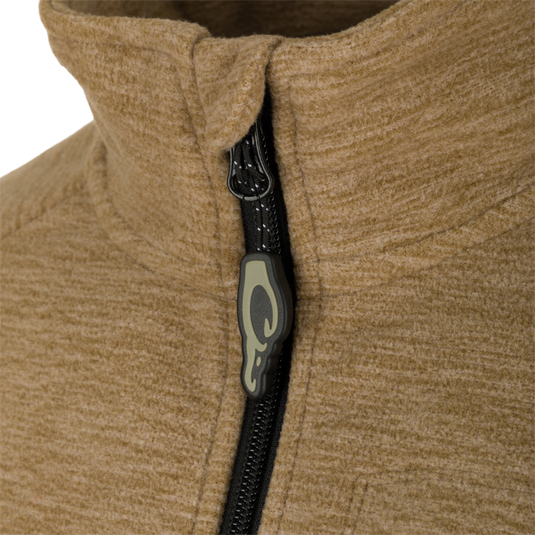 A close-up of the Heathered Windproof 1/4 Zip's vertical YKK zipper pull.