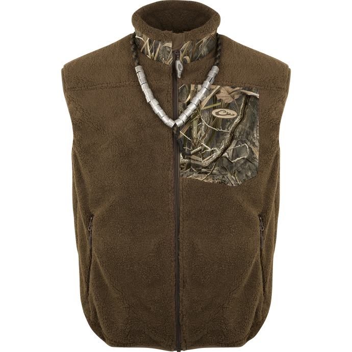 A brown vest with a camo design, made of 100% polyester deep pile sherpa fleece. Windproof membrane for protection. MST Sherpa Fleece Hybrid Liner Vest.