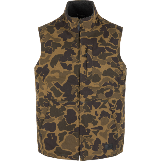 Lifestyle Canvas Sherpa Lined Work Vest in Old School Sport olive and brown camouflage print with a high collar, a zippered chest pocket, and two front hand pockets.
