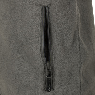 A close-up of the zipper on the Youth Camp Fleece Vest, a durable and comfortable 100% Polyester vest with anti-pill treatment, moisture-wicking properties, and zippered handwarmer pockets.