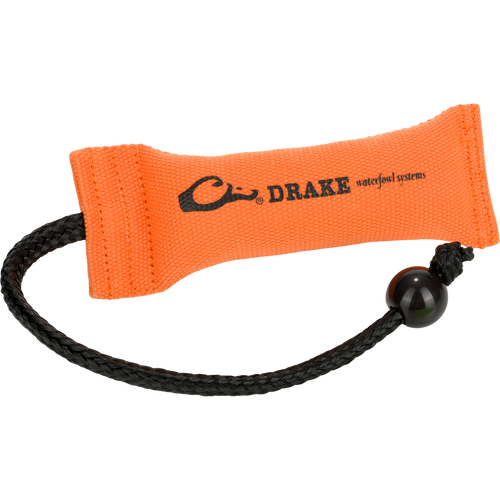 Small Firehose Bumper by Drake Waterfowl, orange canvas dummy with tapered middle, braided cord, and weighted end for easy throwing, ideal for retriever training.