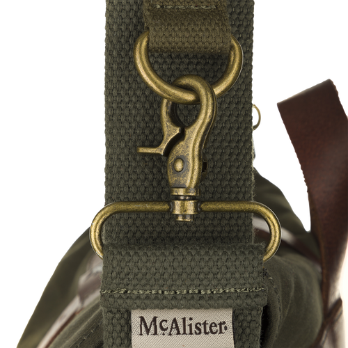 McAlister Wingshot Ditty Bag: A durable bag with waxed cotton, leather trims, and brass hardware. Perfect for hunting, it has a large main compartment and a rear utility compartment. Includes cotton webbing straps and two game totes for easy carrying.