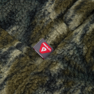 Close-up of PrimaLoft®-insulated fabric on the Non-Typical Statix Sherpa Fleece Insulated Vest, highlighting its windproof, waterproof, and lightweight warmth features.