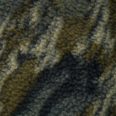 Close-up of the Non-Typical Statix Sherpa Fleece Insulated Vest's wool-like texture, showcasing its soft, windproof sherpa fleece with waterproof features for hunting versatility.