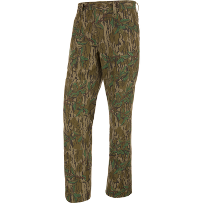 Throwback 80 Field Pant featuring camouflage design, durable cotton twill, reinforced knees, and antique brass riveted pockets, ideal for hunting and outdoor activities.