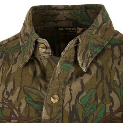 Close-up of the Throwback 80 Button Down Field Shirt, showcasing its durable cotton twill fabric, reinforced elbows, and triple-needle stitching for outdoor adventures.