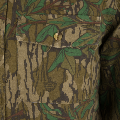 Close-up of a button on the Throwback 80 Button Down Field Shirt, highlighting the durable 8.3oz cotton twill and reinforced stitching for outdoor use.